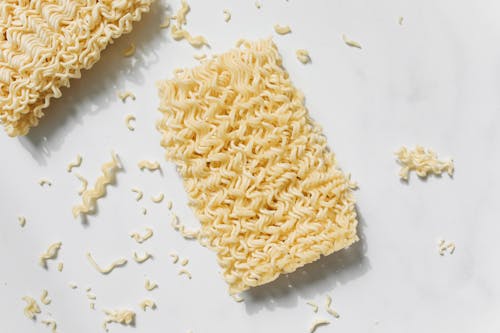 Photo of Uncooked Noodles on White Background