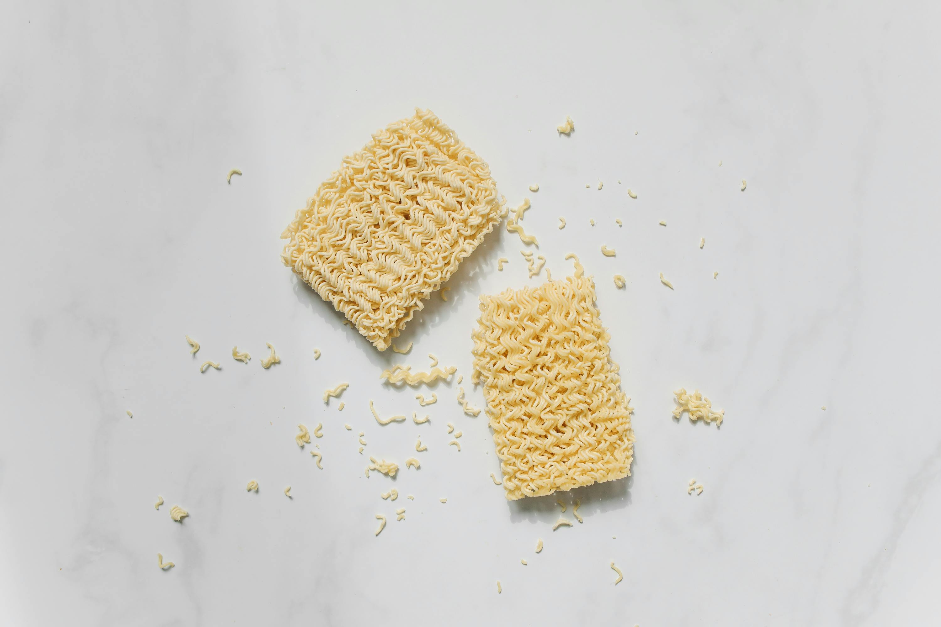 photo of uncooked noodles on white background