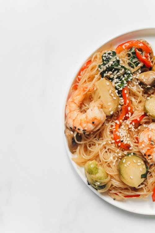Photo of Noodle Dish With Shrimp on White Background
