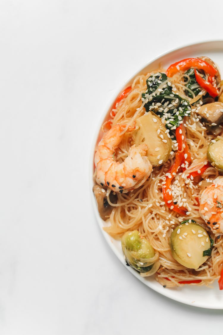 Photo Of Noodle Dish With Shrimp On White Background