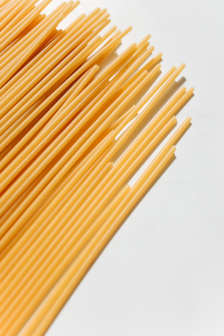 Close-Up Shot Of Uncooked Spaghetti Noodles