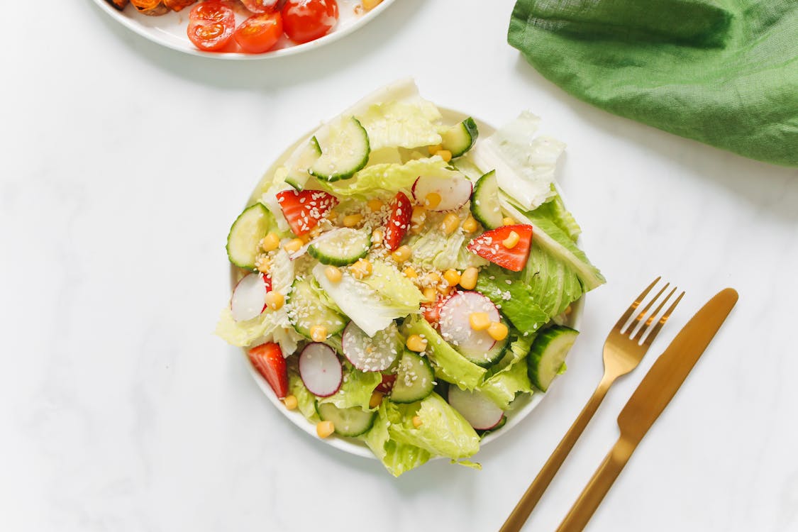 Sliced Tomato and Green Vegetable Salad on White Ceramic Plate