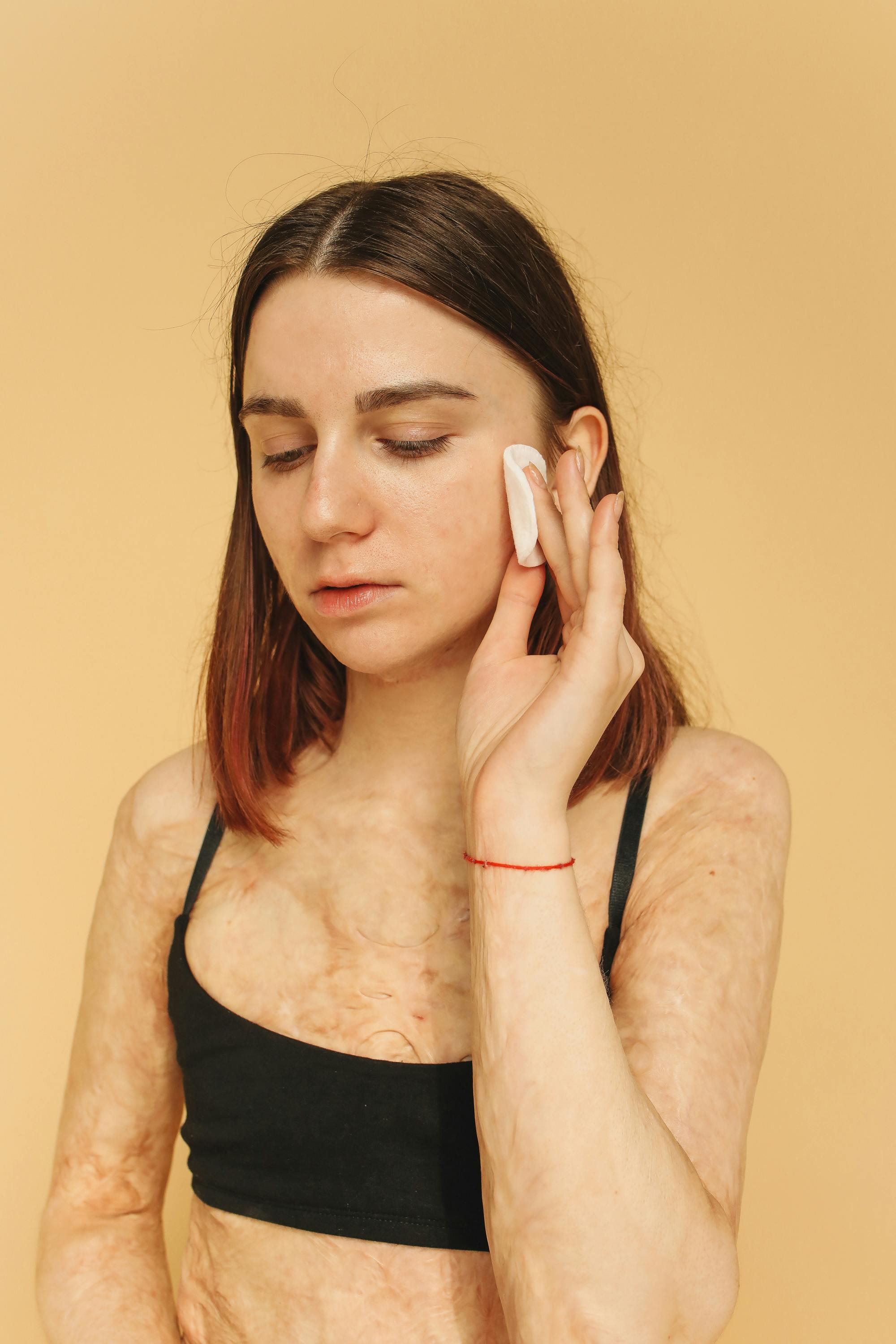 Happy woman enjoying her skincare