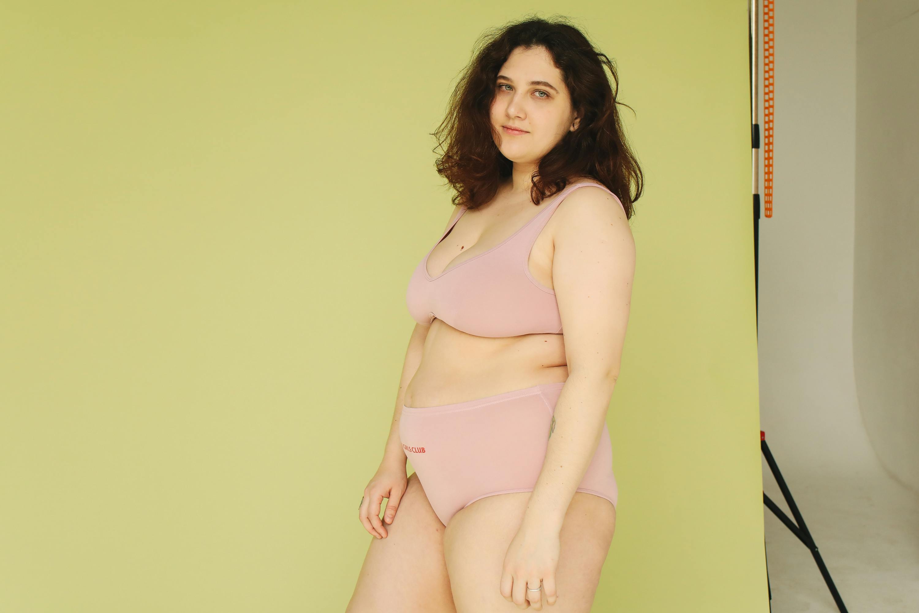 A Beautiful Chubby Woman Wearing Pink Underwear while Looking at the Camera  · Free Stock Photo