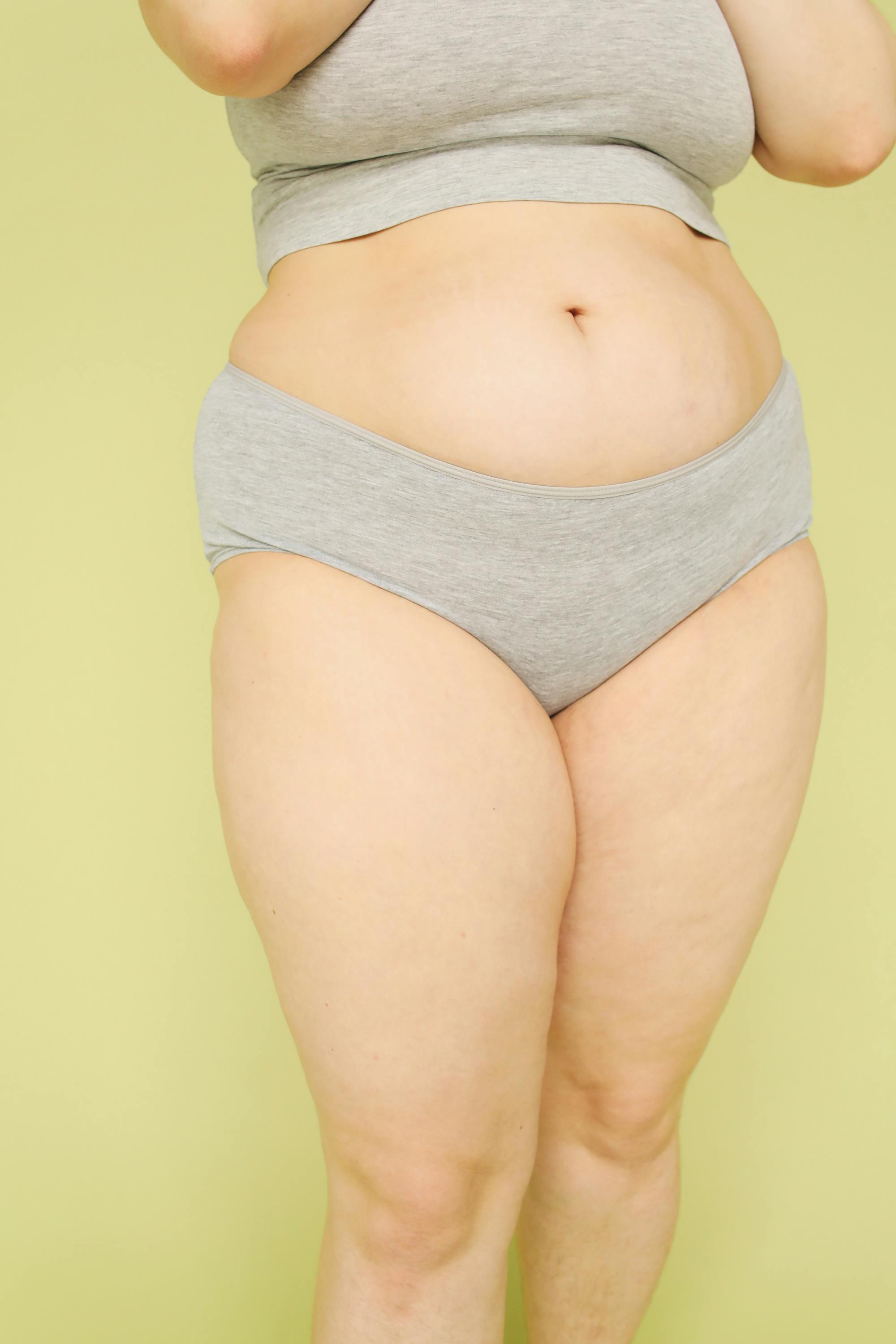 Women Wearing Their Underwear Holding a Sliced Grapefruit · Free