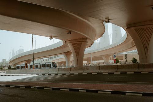 Free Sweeping view of urban highways and transit in Dubai's architectural landscape. Stock Photo