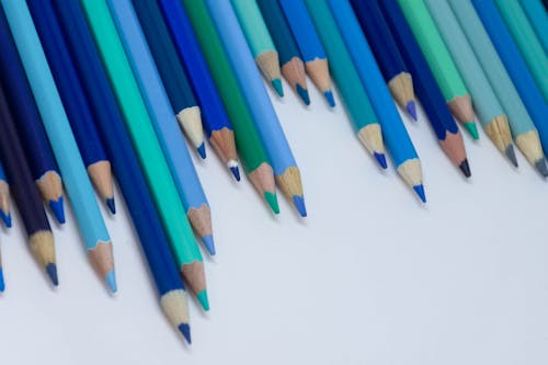 Free Shade of Blue Coloring Pencils on a White Surface Stock Photo