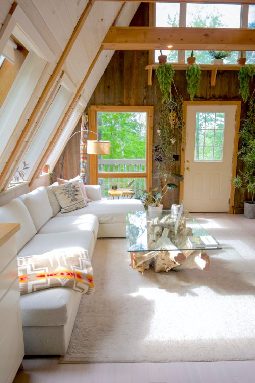Free Bright and airy A-frame cabin living room with modern decor in Stowe, Vermont. Stock Photo