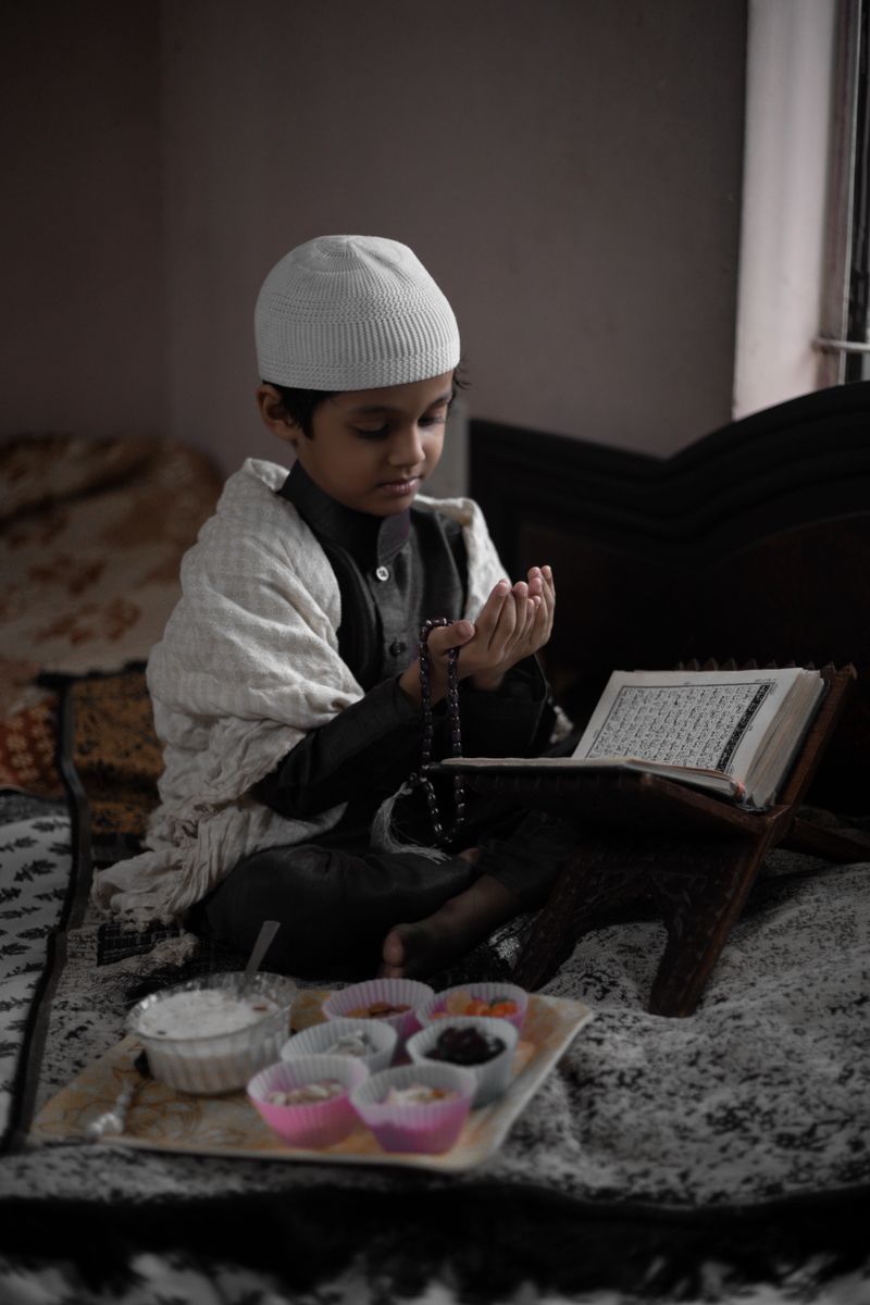 Muslim boy studying Quran