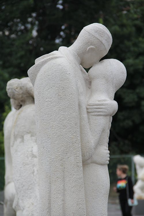 Side view sculpture showing farewell of embraced soldier and young woman located in Moscow Russia