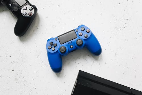 Free Game Controllers Near PS4 Stock Photo