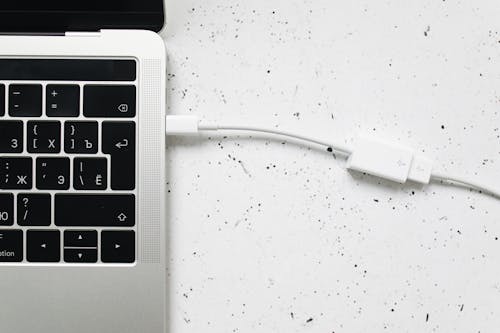 Free White Usb Cable Connected in Gray Laptop Computer Stock Photo