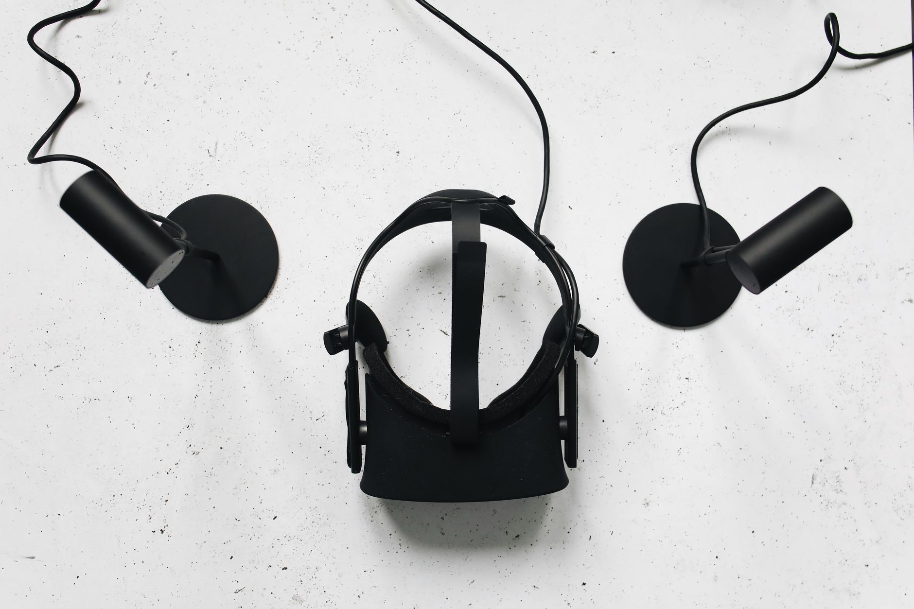 Top view of a VR headset and sensors, highlighting modern technology.