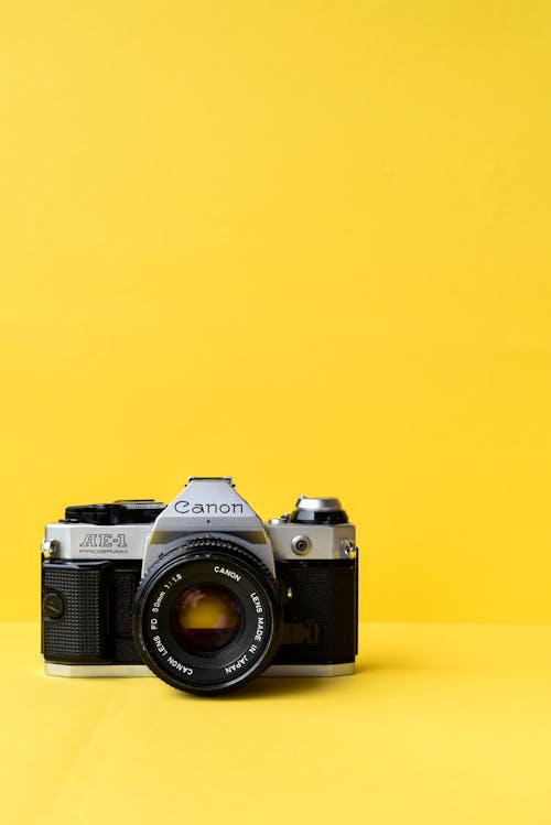 Free Film Camera on Yellow Background Stock Photo