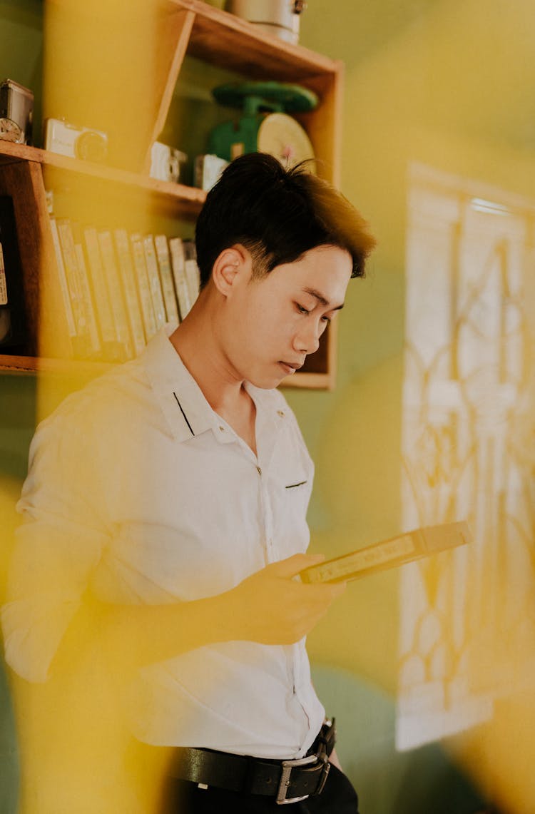 Asian Man With Old Video Cassette At Home