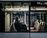 Unrecognizable passenger in bus during COVID 19 pandemic