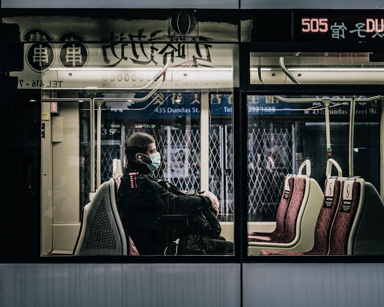 Unrecognizable Passenger In Bus During COVID 19 Pandemic