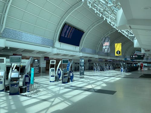 Free Creative design interior of contemporary airport with corridor under information board and signboards Stock Photo