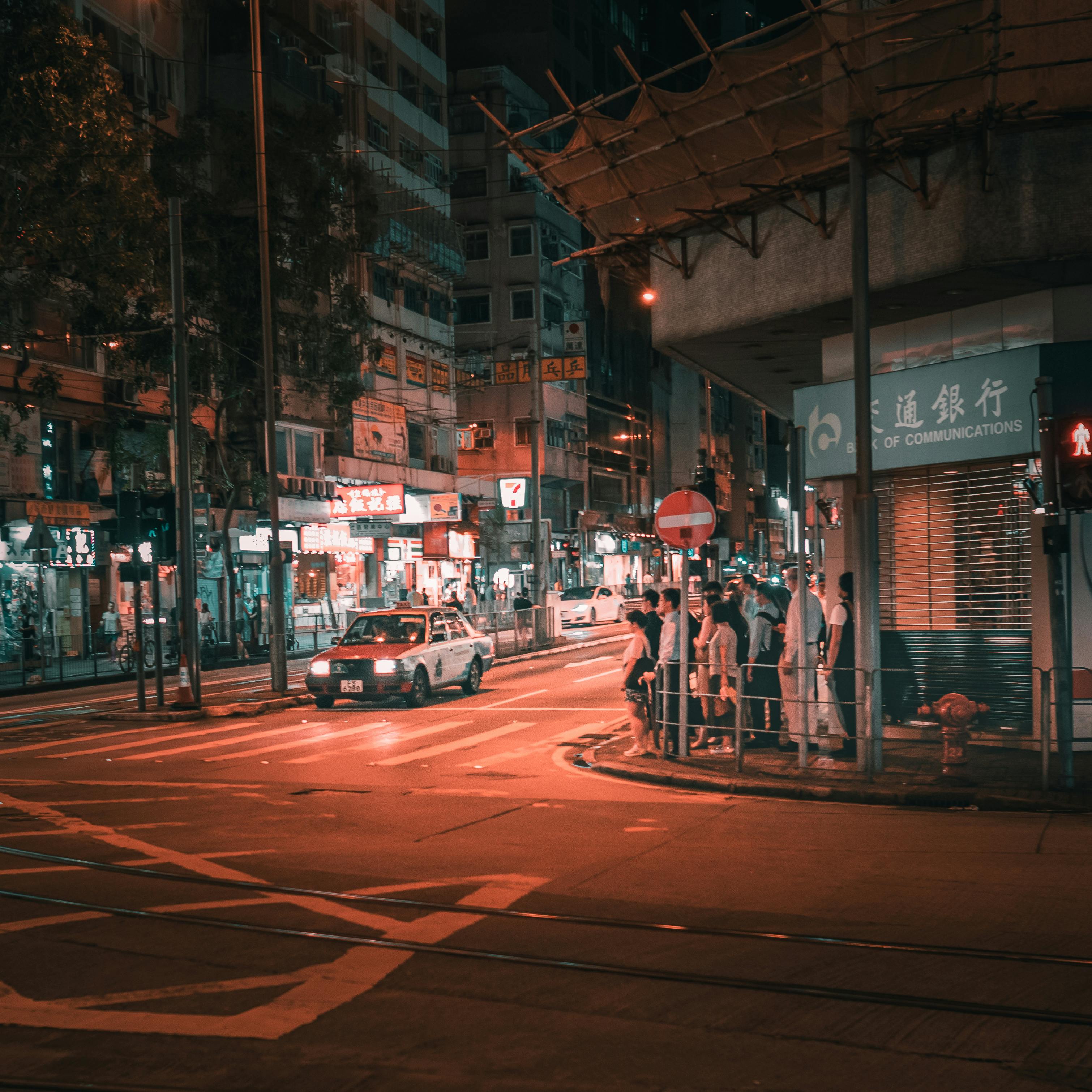 Auto show building with shining signboard in evening · Free Stock Photo