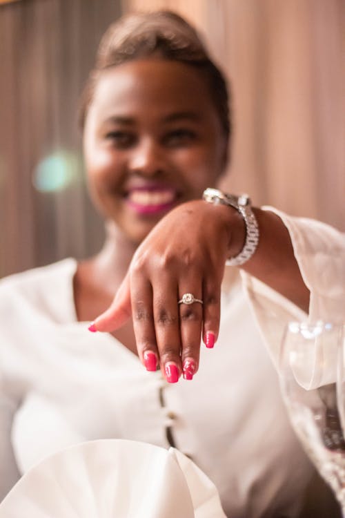 Woman in White Dress Wearing a Ring