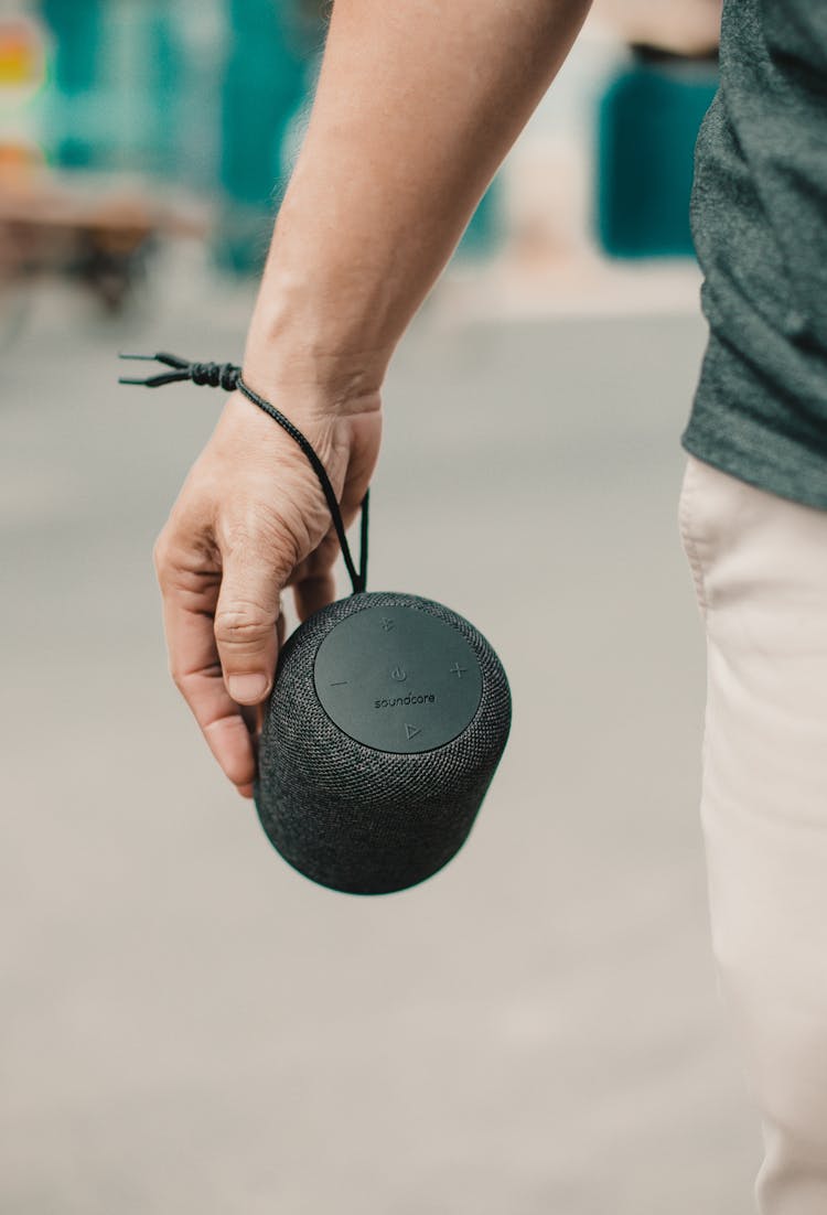 Faceless Man With Portable Loudspeaker On Street