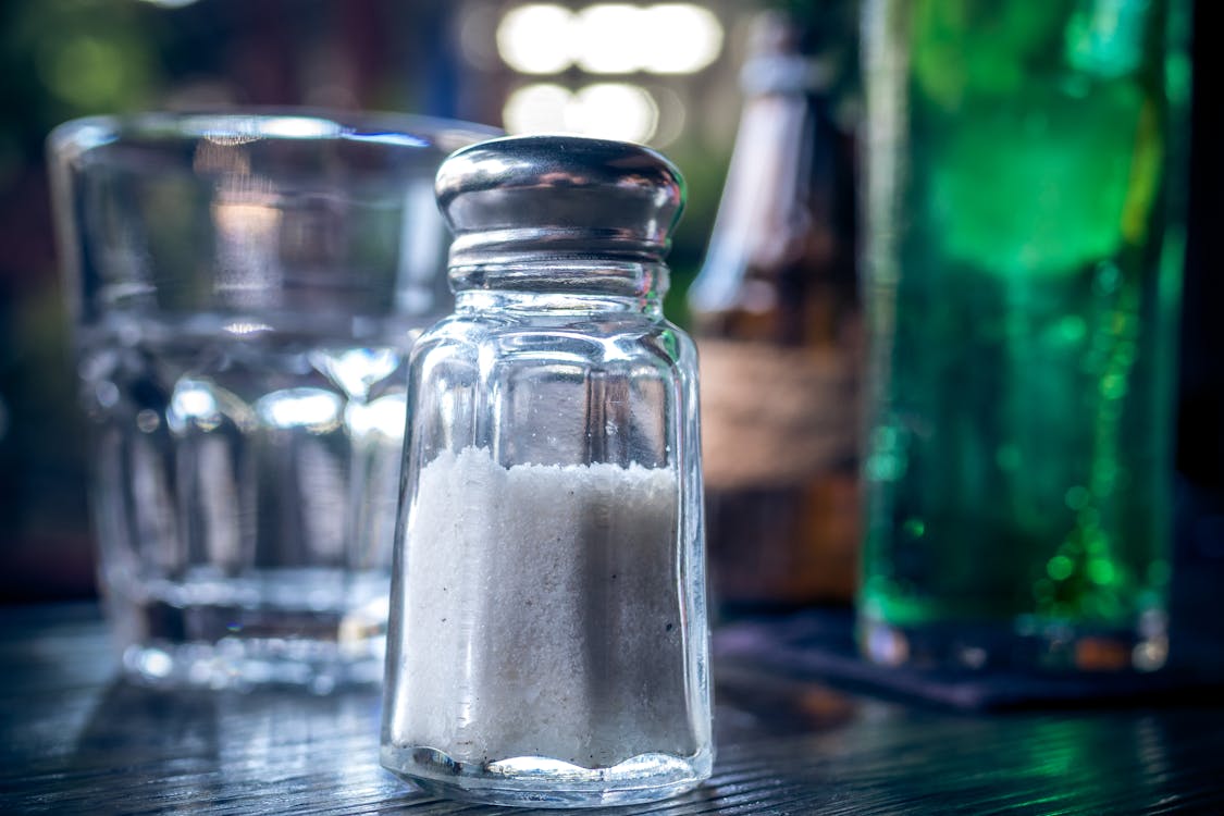 Selective Focus Photography of Clear Glass Condiment Shaker