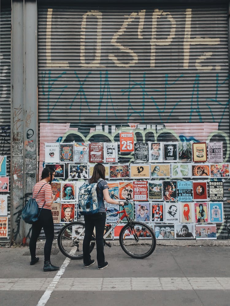 Posters On Gray Metal Shutter 