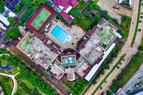 Top View Shot of a Swimming Pool Surrounded By Buildings