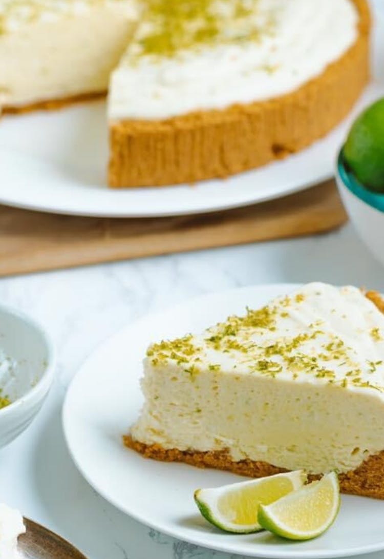 Sliced Key Lime Pie On White Ceramic Plate