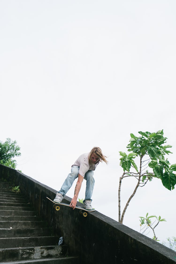 Skater Board Sliding Down On Stair Ledge