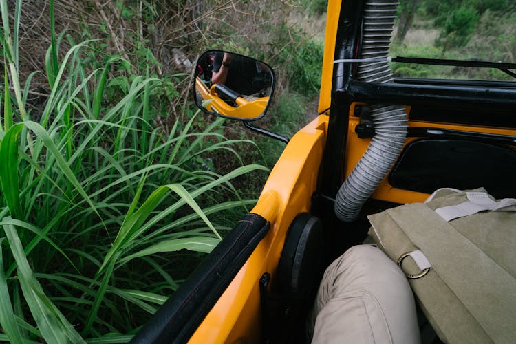 Crop Man Taking Selfie In Offroader Rear Viewer