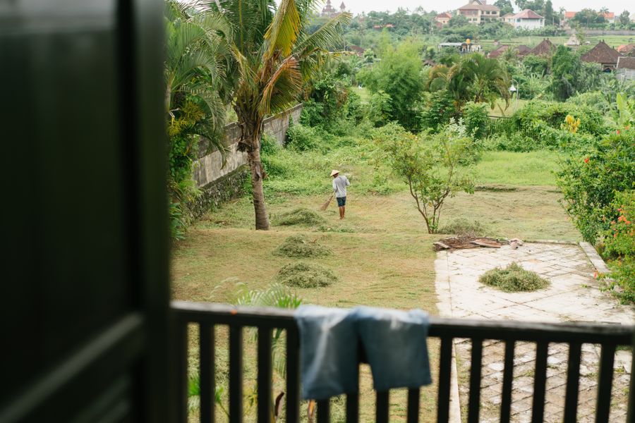 Landscaper preparing soil in a backyard bed