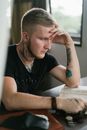 Thoughtful young man studying in quiet room