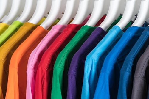 Free Hangers with colorful cotton t shirts in wardrobe Stock Photo