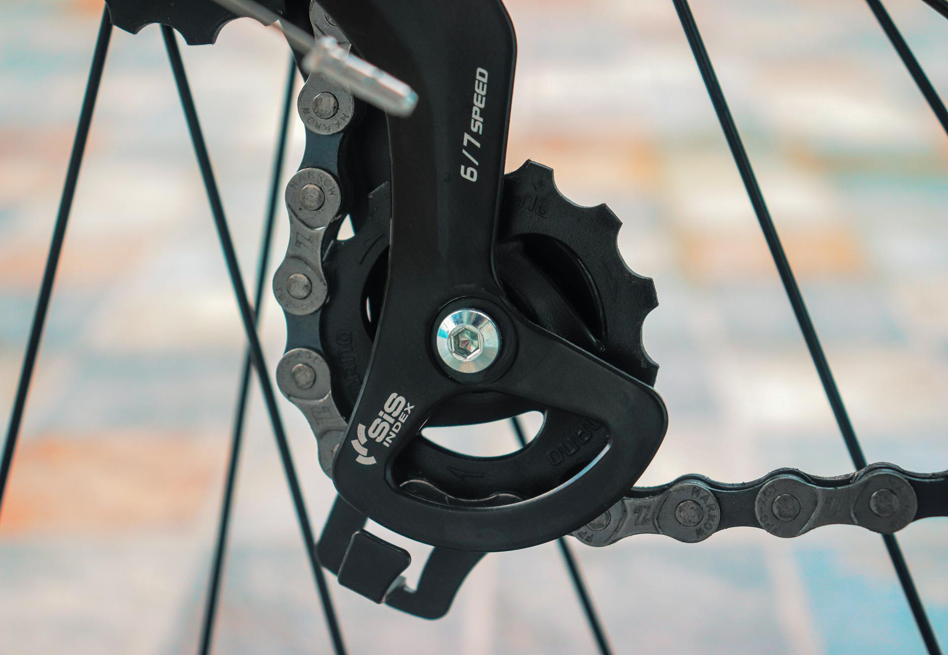 Detailed view of bicycle gear and chain with Shimano SIS Index system.