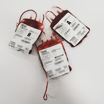 Blood bags labeled A, B, and O for donation and transfusion use.