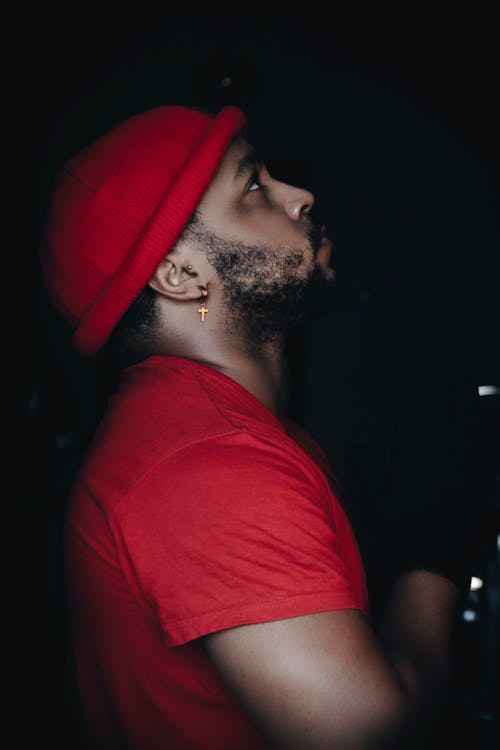 A Bearded Man Wearing a Bonnet and a Red Shirt