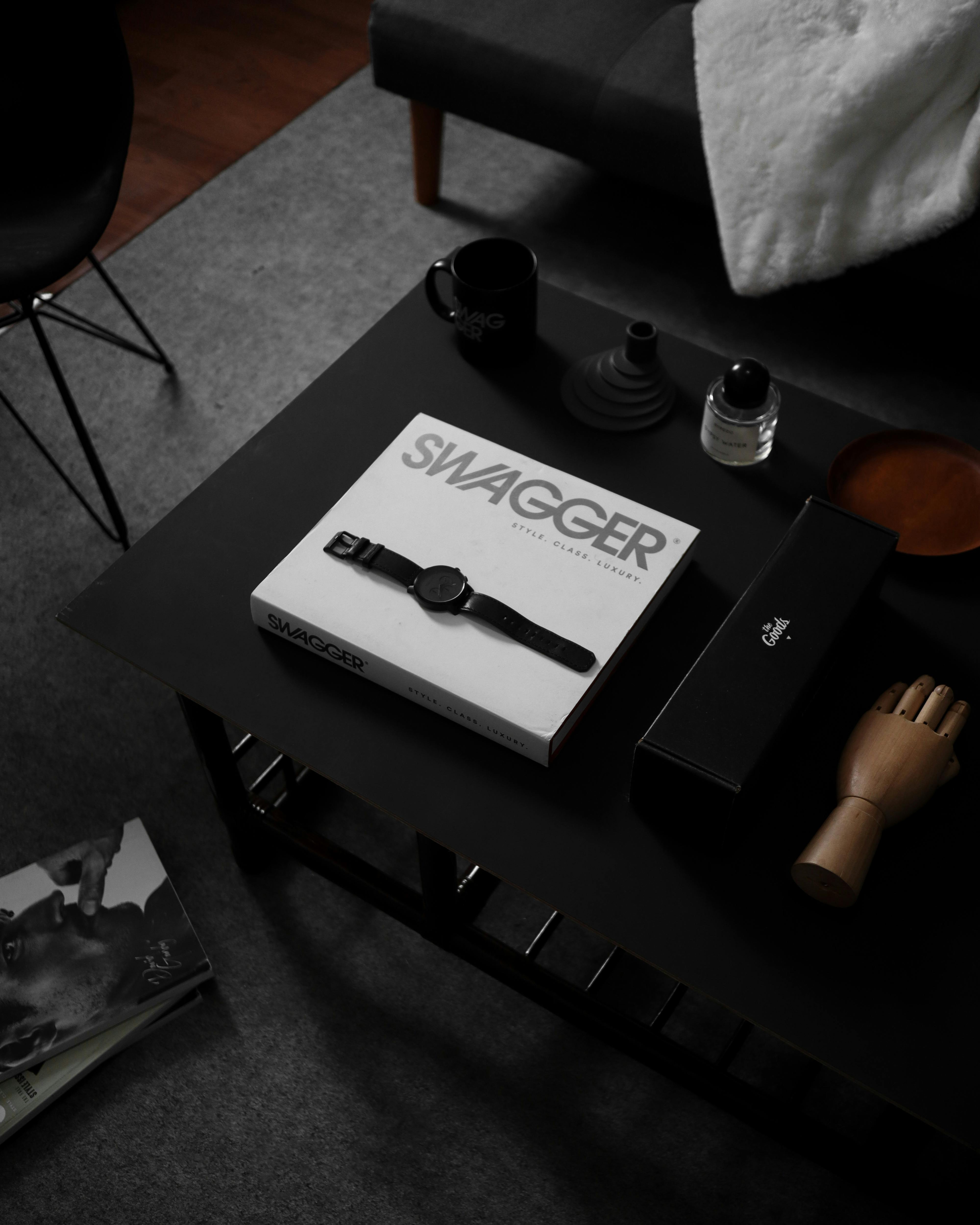 Stylish setup with a wristwatch on a sleek coffee table in a modern living room setting.
