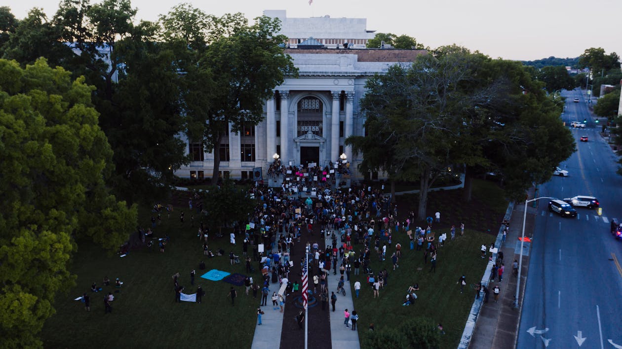 Protesters Gathered in front of a Building · Free Stock Photo