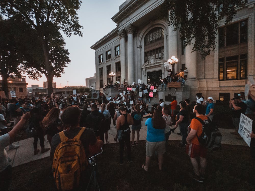 Protesters Gathered in front of a Building