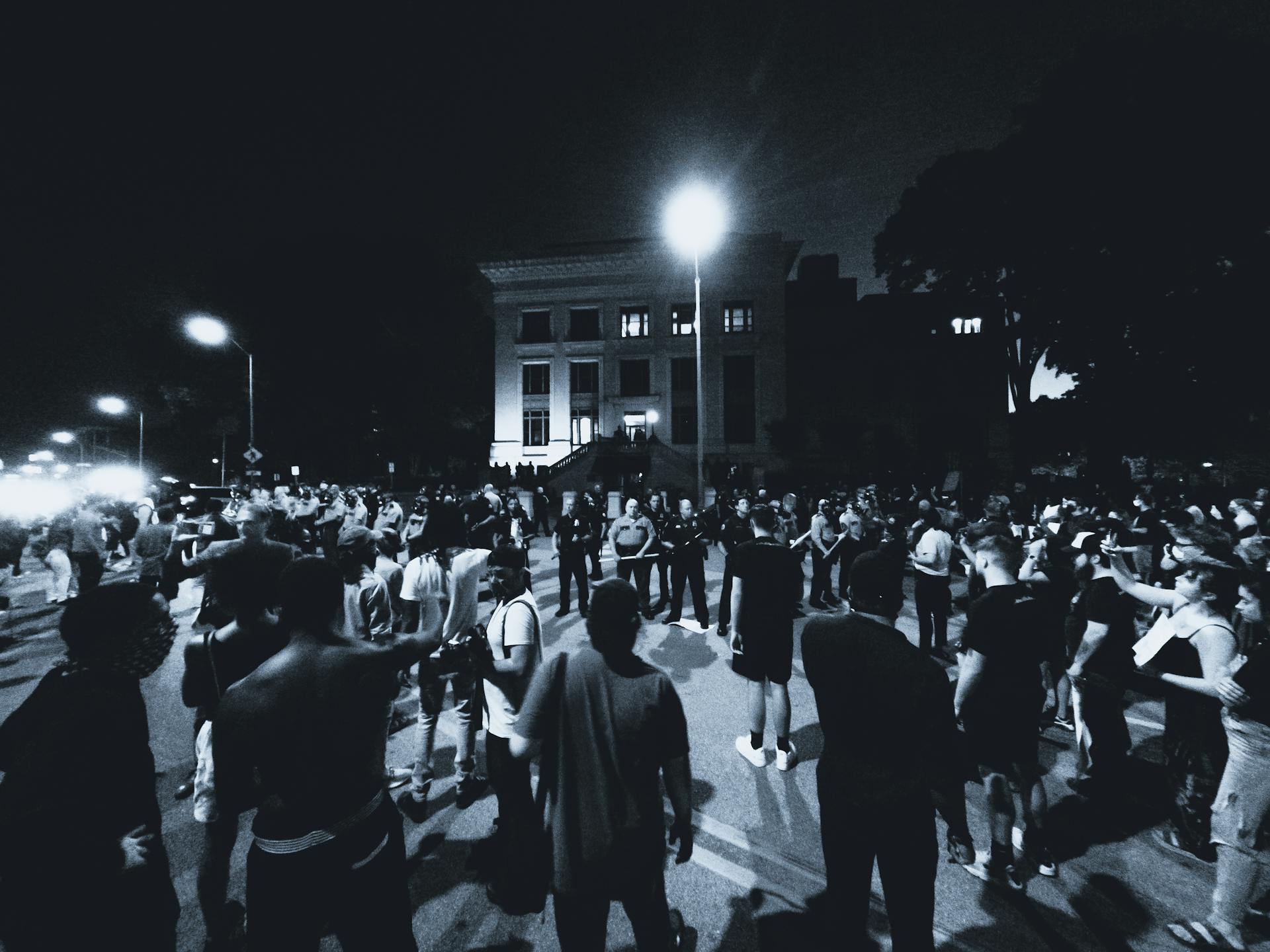 Grayscale Photo of Protesters on a Street