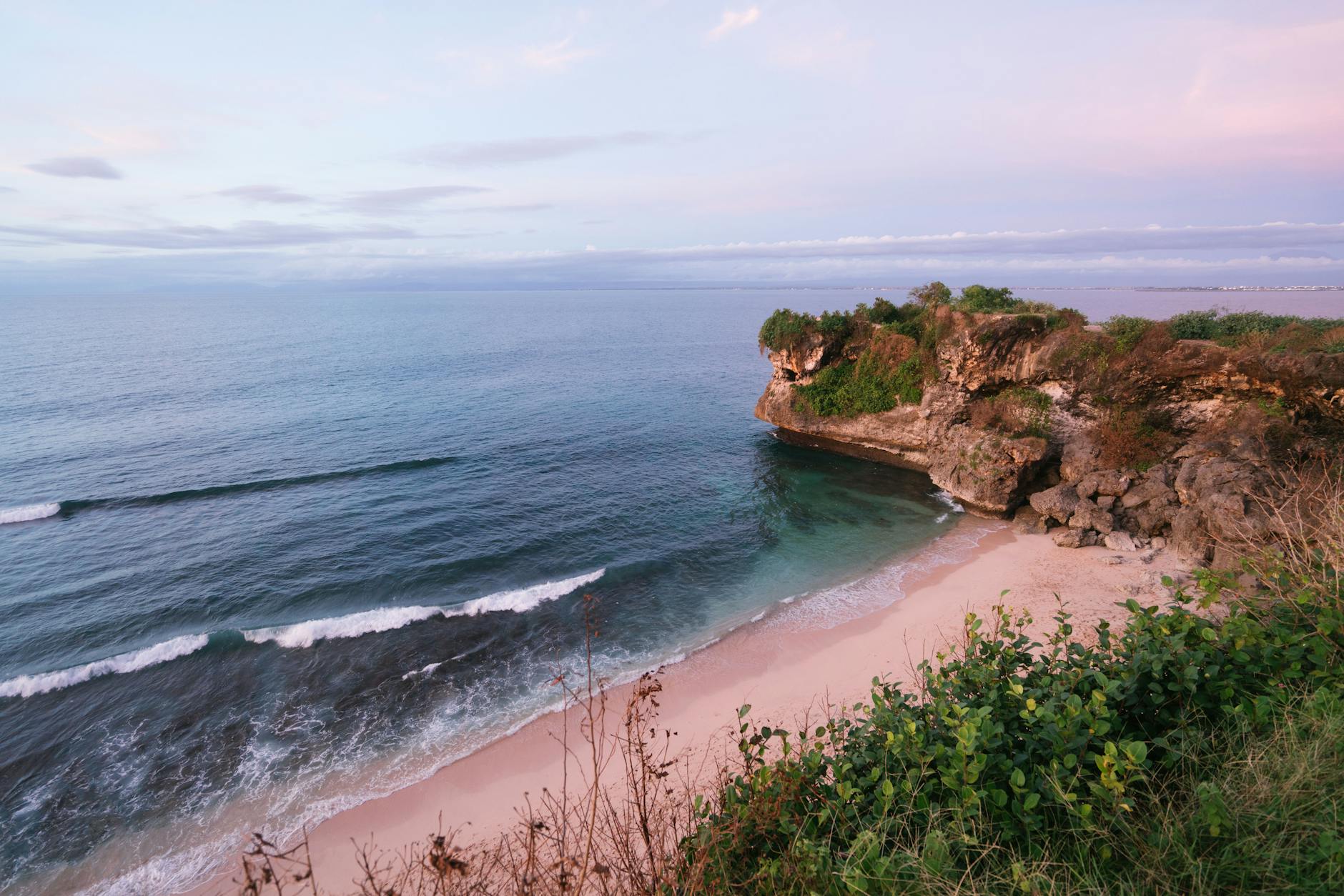 Amazing view of beach with rocky cliff