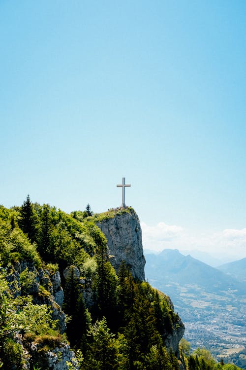 Free Lonely cross on slope of mountain Stock Photo