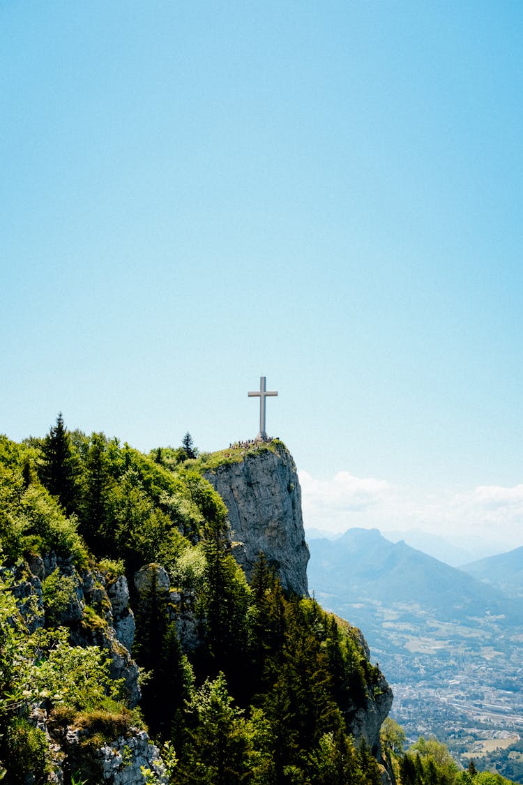 Lonely Cross On Slope Of Mountain