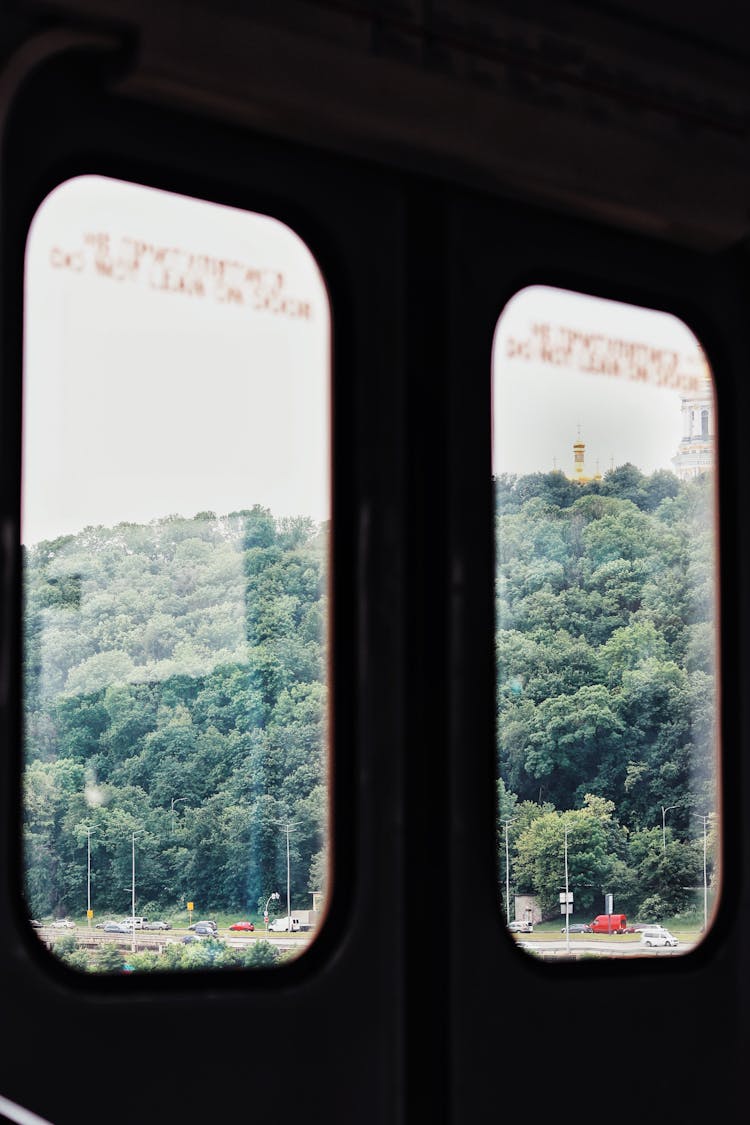 Door Of Train Going Along Green Valley