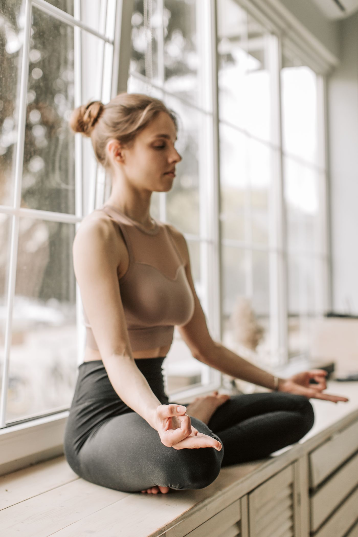 Woman sitting peacefully in warm natural light