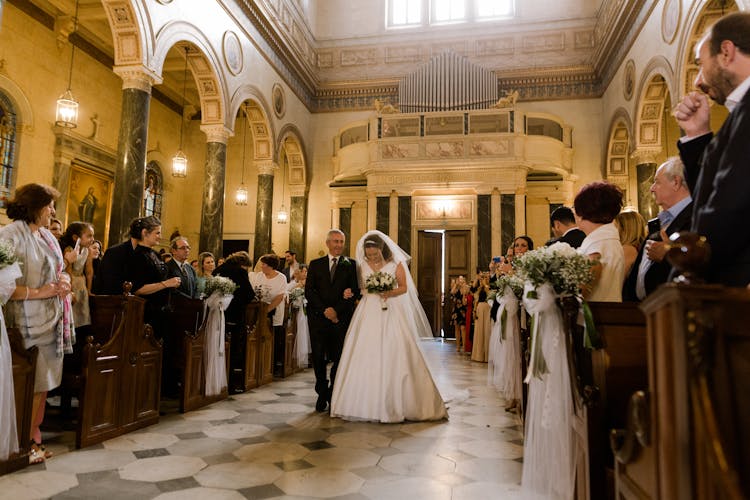 Father Of The Bride Walking Down The Aisle With Daughter