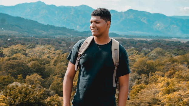 A smiling young backpacker enjoys a scenic view in the Dominican Republic mountains.
