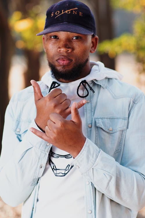 A Man in Blue Denim Jacket