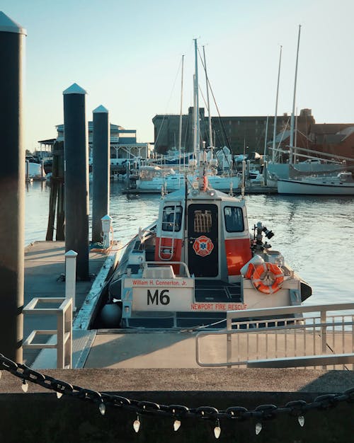 White and Red Boat on Dock